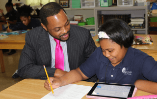 Man talking with Student working